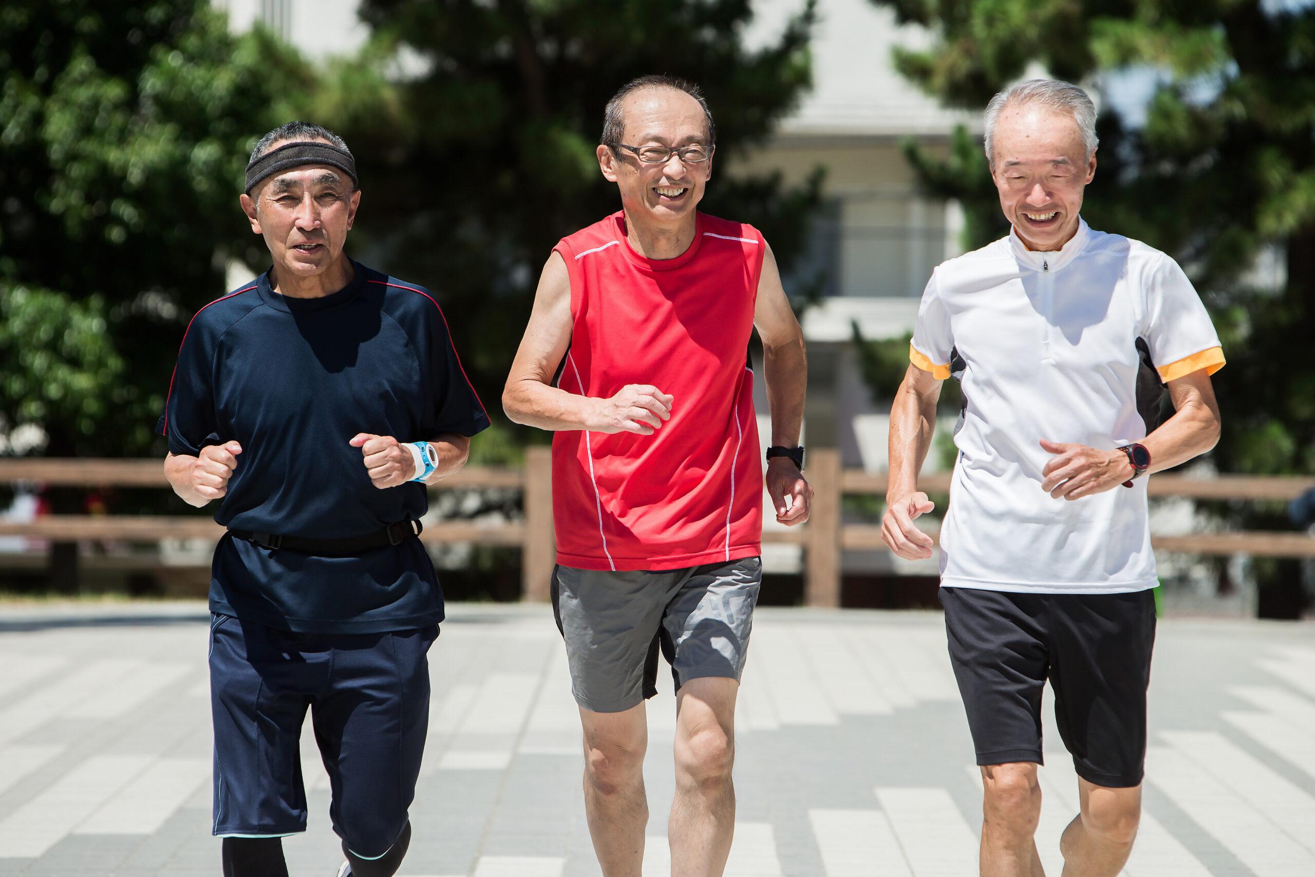 Senior men enjoying jogging with friends.